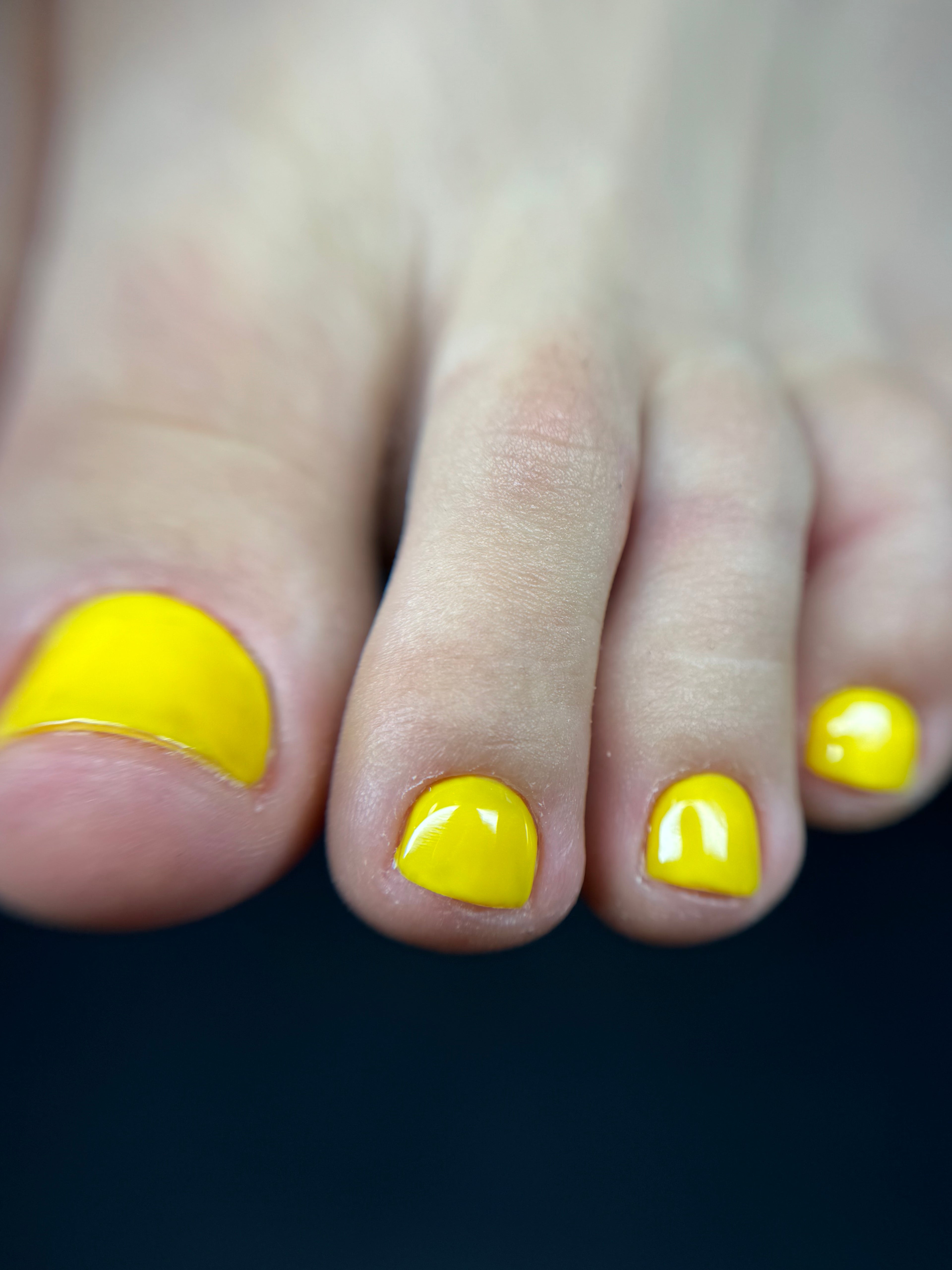 Luxury dry e-file pedicure with clean cuticle work & yellow gel polish finish.